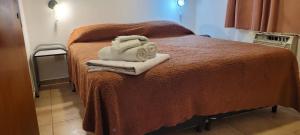 Postel nebo postele na pokoji v ubytování Cabañas Los Quijotes + 45 fotografií