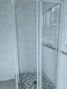 a shower with a glass door in a bathroom at ChoosersExpressHotel in Centurion +25 photos
