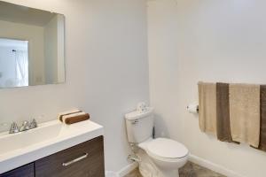 a bathroom with a toilet and a sink and a mirror at Old Orchard Beach Vacation Rental, Walk to Ocean! in Old Orchard Beach +22 photos