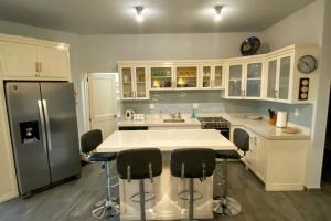 a kitchen with white cabinets and a white counter top at 2B - Cerritos Beach Condo, Lrg Pool, Baja Sur in El Pescadero