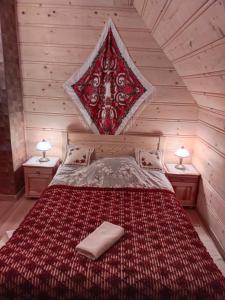 A bed or beds in a room at Domek Jurgów 406