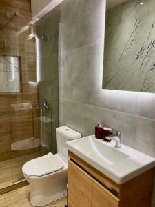 a bathroom with a toilet and a sink and a shower at Jack, 2 people, renovated stylish apartment in Athens