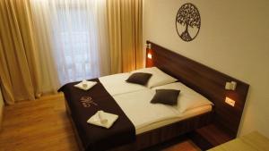 Postel nebo postele na pokoji v ubytování WX Hotel