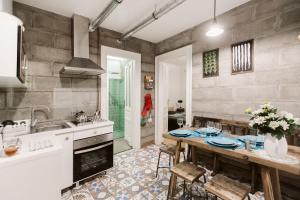 a kitchen with a table and a sink at The Double Vintage & Handcrafted in Budapest