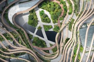 an overhead view of a city with roads and trees at The Modern Loft 1BR in Singapore! in Singapore