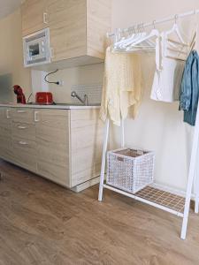 a kitchen with a sink and a ladder in a room at SANTANDER-LIENCRES VILLA PERAL in Liencres