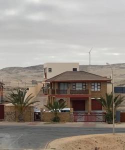 a house in the middle of the desert at The Oasis Accommodation in Lüderitz