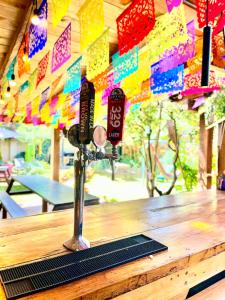 a pole on top of a wooden counter with flags at The Coffee Bean Hostel in San Cristóbal de Las Casas