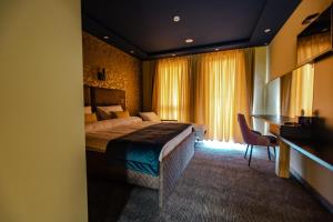 Ein Bett oder Betten in einem Zimmer der Unterkunft HOTEL LOBBY