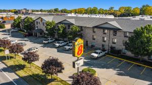 an overhead view of a hotel with cars parked in a parking lot at Super 8 by Wyndham Mt. Pleasant in Mount Pleasant