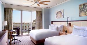 a hotel room with two beds and a window at The Ritz Carlton Key Biscayne, Miami in Miami