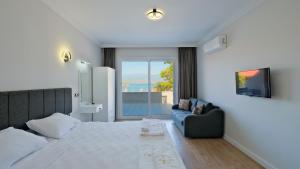 Postel nebo postele na pokoji v ubytování Miralya Suites + 10 fotografií