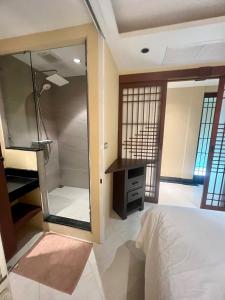 a bedroom with a large mirror and a bed at Luxury Apartment Kata Beach The Accenta in Kata Beach