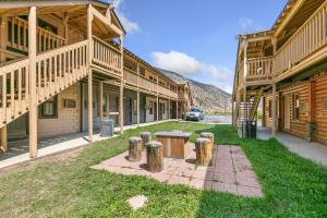 a row of wooden buildings with a table in the grass at Georgetown Lodge in Georgetown