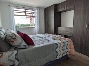 a bedroom with a bed and a large window at Guatemala, departamento ciudad capital zona 12. in Guatemala