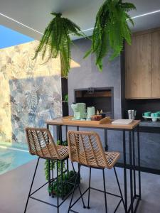 a kitchen with a table and two chairs and a table at VIP_RUIDERA_HOME in Ruidera