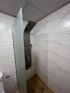 a bathroom with a shower with a glass door at Wadi rum desert sky in Wadi Rum
