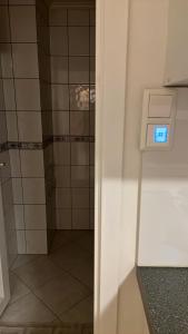 a bathroom with a shower with a glass door at Apartment in Åsane in Bergen