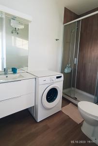a bathroom with a washing machine and a sink at MNG-APART Studia Mareverde D-15 Costa Adeje in Adeje