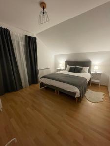 Postel nebo postele na pokoji v ubytování Apartman Magnolia