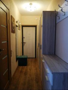 a hallway with a room with a door and a hallway at Baby friendly 1-bedroom rental w/ free parking in Sigulda