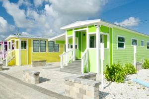a row of colourful houses on a beach at Sunshine Tiny Home Pinecraft in Sarasota