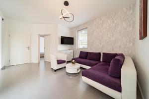 TV a/nebo společenská místnost v ubytování Appartement 2 - Dünenblick