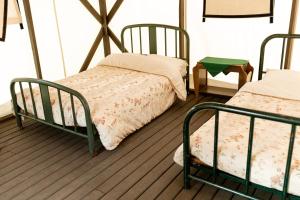 a room with two bunk beds in a room at Kumsheen Rafting Resort in Lytton