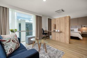Postel nebo postele na pokoji v ubytování Novelty Suites Hotel + 37 fotografií