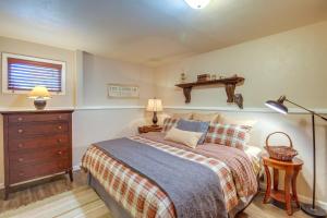 a bedroom with a bed and a dresser and a window at Red Lodge Mountain Home Less Than 7 Miles to Ski Slopes! in Red Lodge