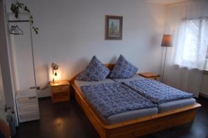 Säng eller sängar i ett rum på Niederburger Herberge