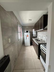 A cozinha ou cozinha compacta de Confortable Apartamento en Mendoza