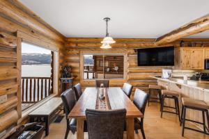 a dining room with a table and chairs at King's Cabin in West Yellowstone
