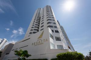 a tall white building with aaa regatta hotel at Hotel Regatta Cartagena in Cartagena de Indias