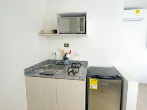 Kuchyň nebo kuchyňský kout v ubytování Magico Apartaestudio con Piscina 1 Habitacion PR56A + 7 fotografií