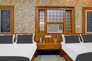 Voodi või voodid majutusasutuse Collection O Hotel Shaurya toas