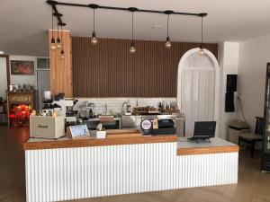 a kitchen with a counter top with a counter top at Jinbo Betong Home Cafe’ in Betong