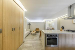 a kitchen with a sink and a counter top at Lumina at Cardinal San José del Cabo in San José del Cabo