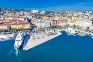 an aerial view of a harbor with boats in the water at Apartments by the sea Rijeka - 13293 in Rijeka