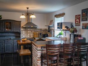 a kitchen with a table and some chairs in it at Charming cottage in Gimn e in Doische