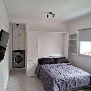 Postel nebo postele na pokoji v ubytování Estudio SMART en Recoleta