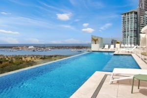 a large swimming pool with a view of a building at Luxury La Isla in Gold Coast