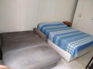 Łóżko lub łóżka w pokoju w obiekcie Apartamento Temporada Copacabana