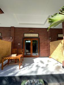 Posezení v ubytování Tebu menjangan homestay