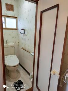 a bathroom with a toilet and a sink at Bay View House private room / Vacation STAY 3667 in Otaru