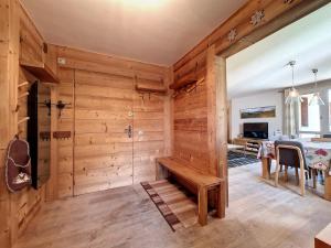 a room with a wooden wall with a bench in it at Appartement Val-d'Isère, 4 pièces, 8 personnes - FR-1-518-146 in Val-d'Isère