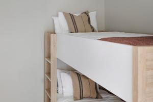 a couple of bunk beds in a bedroom at Motel Caloundra in Caloundra