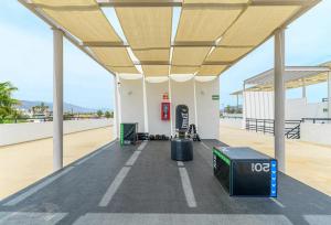 a gas station with awning and a gas pump at Lumina at Cardinal San José del Cabo in San José del Cabo