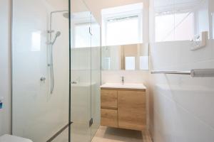 a bathroom with a shower and a sink at Character and Charm on Emerald Hill in Melbourne