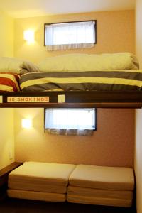 Posteľ alebo postele v izbe v ubytovaní 名古屋 Sakuraya 全屋抗菌涂层预防处理 6分钟直达名古屋车站 2间独立卫生间 2间独立淋浴房 4间卧室